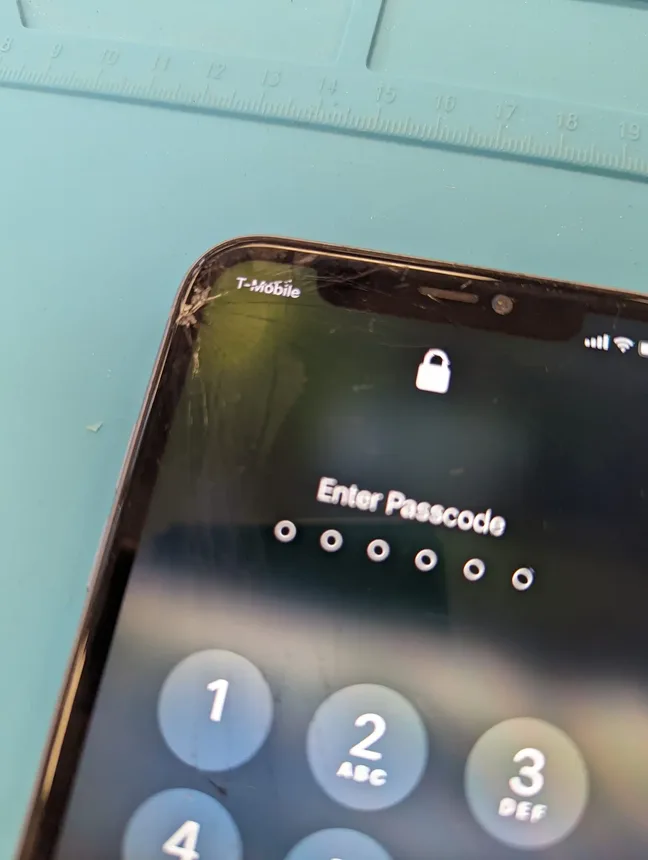Cracked iPhone screen before repair